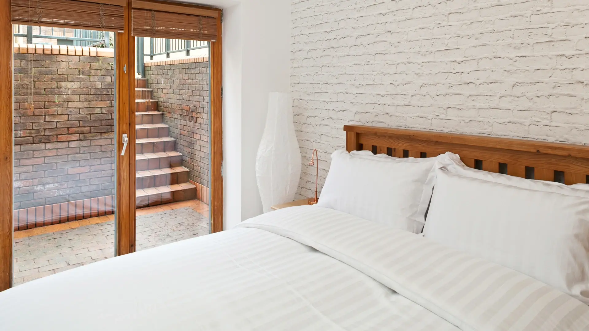 Bright contemporary bedroom with private terrace