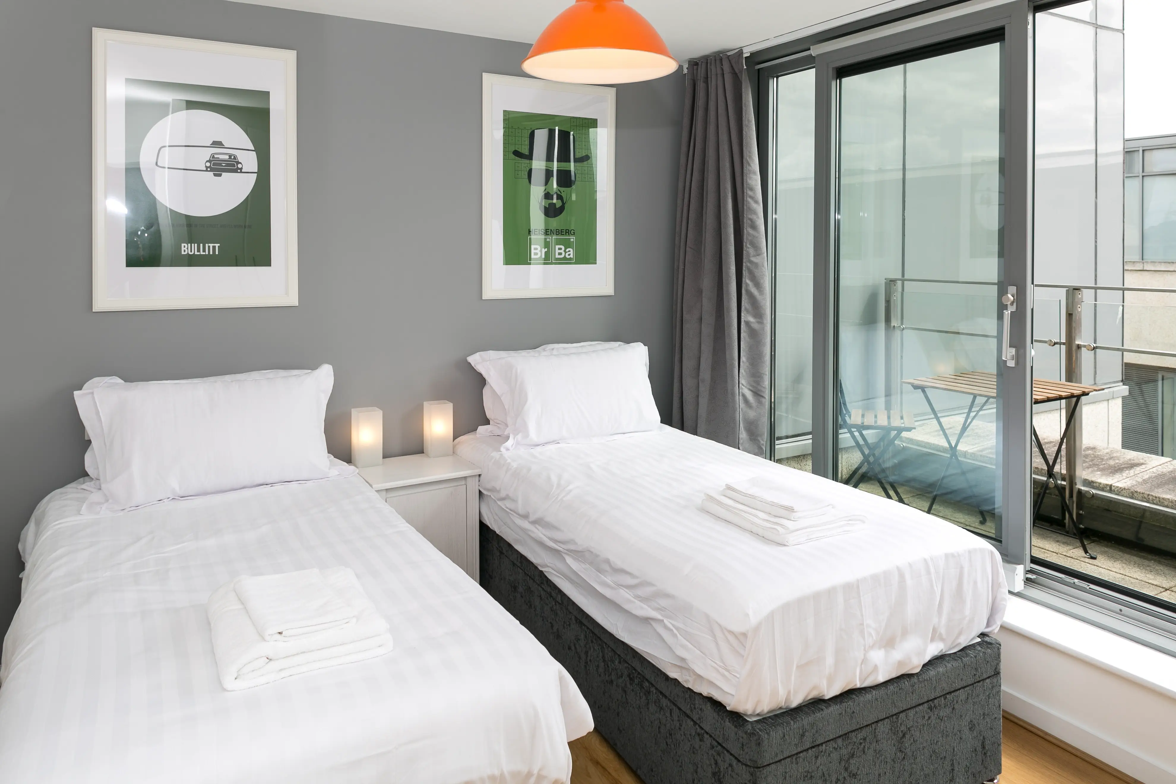 Twin bedroom with floor to ceiling windows