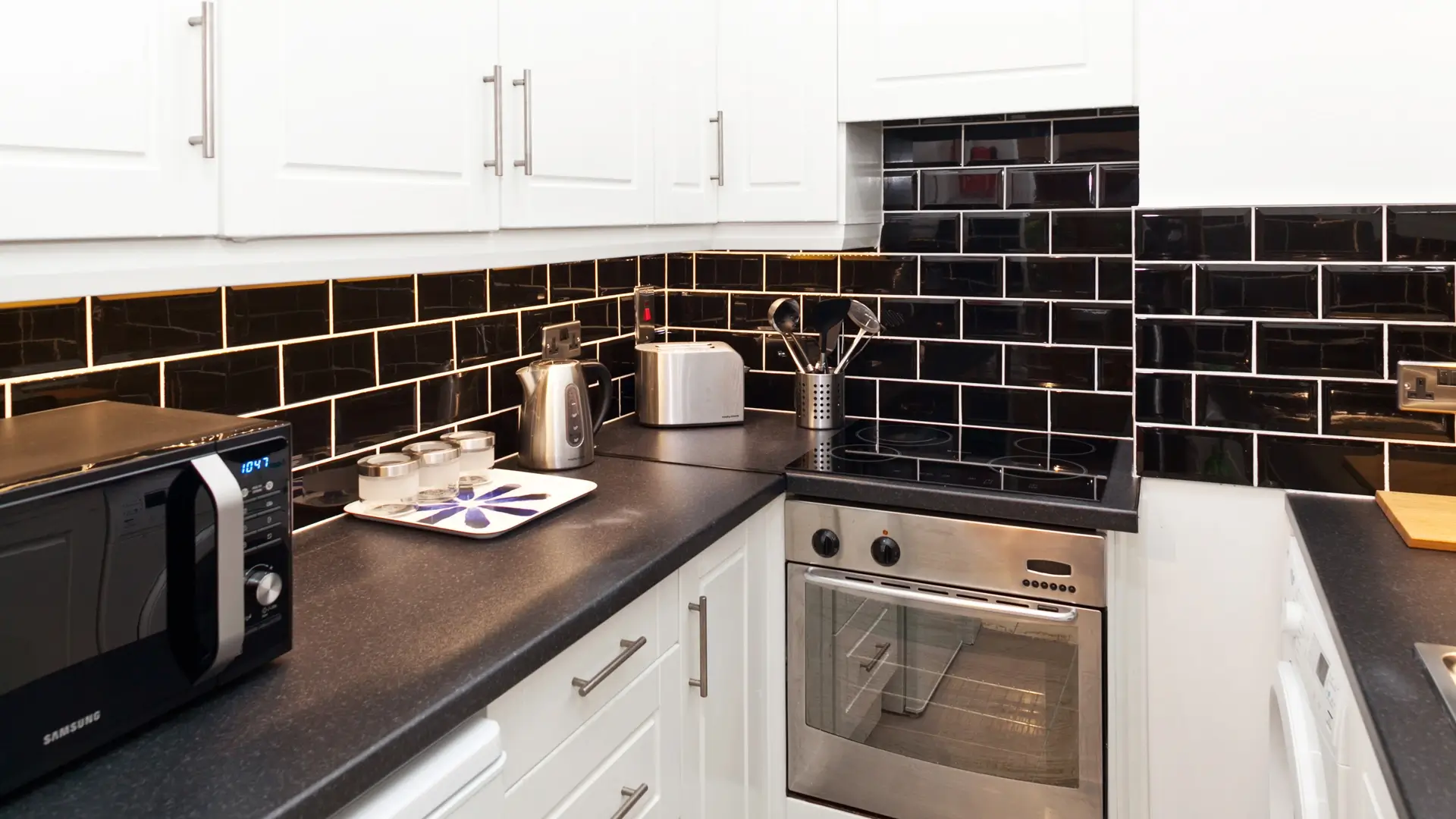 Minimalist galley kitchen with premium furnishings