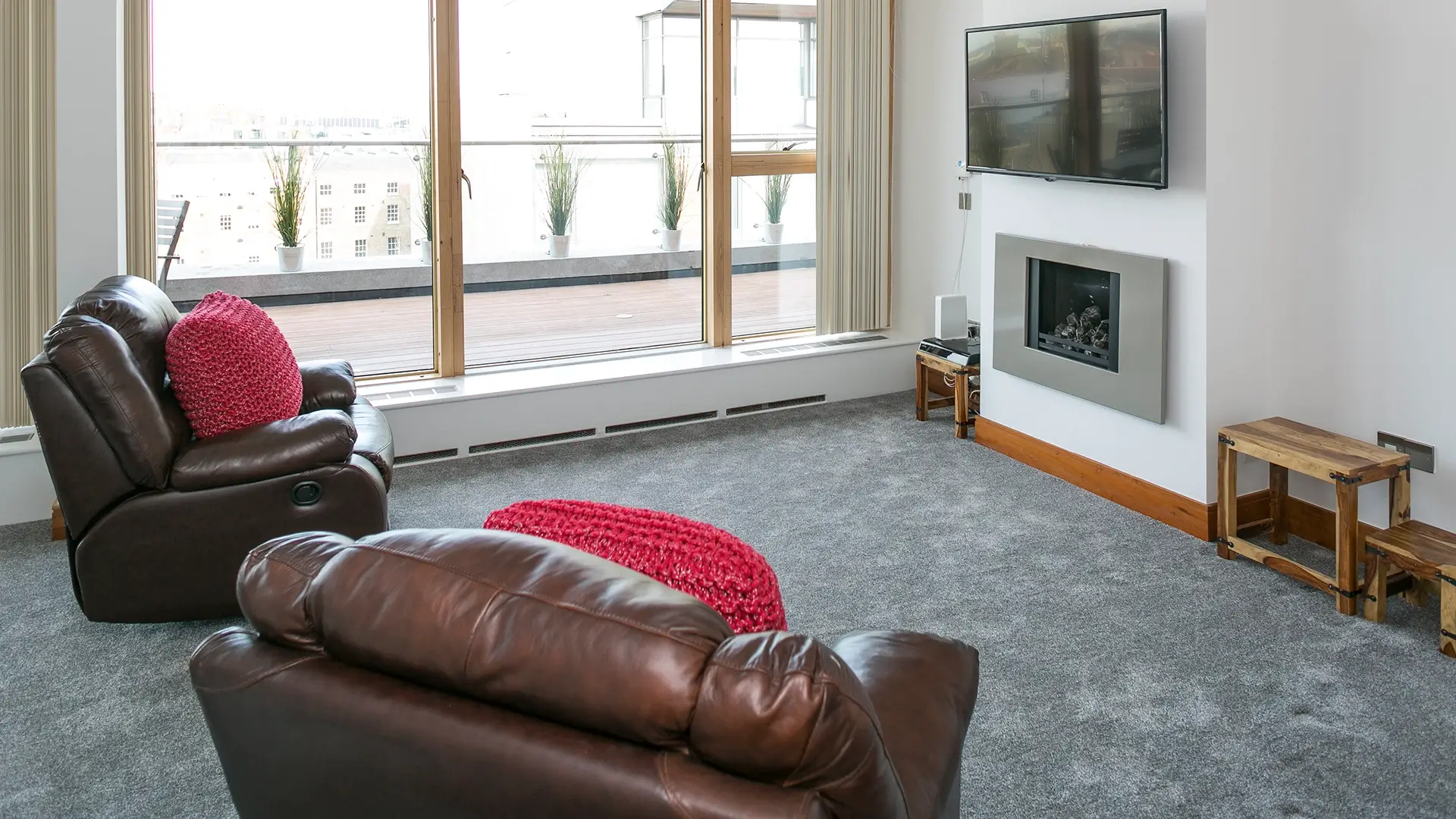 Bright living room with floor to ceiling windows